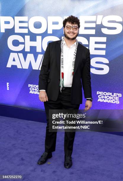 Pictured: Ahmad Aburob arrives to the 2022 People's Choice Awards held at the Barker Hangar on December 6, 2022 in Santa Monica, California. --