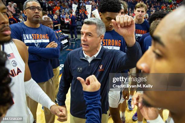 Head coach Tony Bennett of the Virginia Cavaliers huddles up with players before the start of a game at John Paul Jones Arena on December 3, 2022 in...