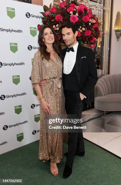 Christina Estrada and Mark-Francis Vandelli attend The Lady Garden Gala 2022 at Claridge's Hotel on December 06, 2022 in London, England.