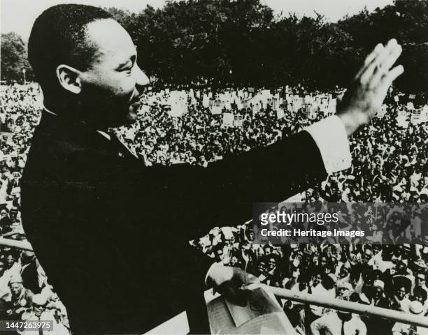 Dr. Martin Luther King, Jr. Waving to the crowd from the steps of the Lincoln Memorial during the March on Washington, 1963. Creator: Unknown.