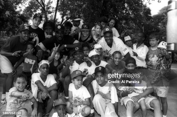 Rapper Chuck D of Public Enemy, Charles Oakley of the New York Knicks and Rick Mahorn of the New Jersey Nets visit a park in Jersey City to meet with...