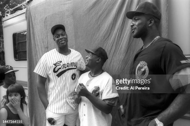 Rapper Chuck D of Public Enemy, Rick Mahorn of the New Jersey Nets and Charles Oakley of the New York Knicks visit a park in Jersey City to meet with...