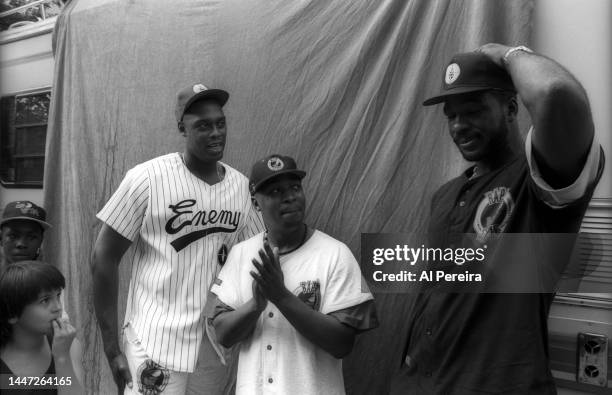 Rapper Chuck D of Public Enemy, Rick Mahorn of the New Jersey Nets and Charles Oakley of the New York Knicks visit a park in Jersey City to meet with...