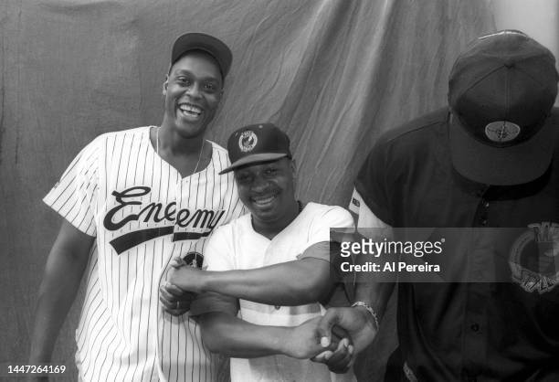 Rapper Chuck D of Public Enemy, Rick Mahorn of the New Jersey Nets and Charles Oakley of the New York Knicks visit a park in Jersey City to meet with...