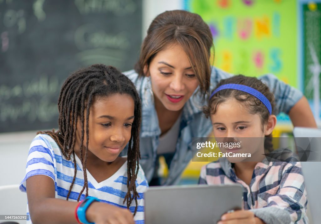 Teacher Assisting Students