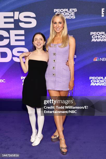 Pictured: Esther Povitsky and Nikki Glaser arrive to the 2022 People's Choice Awards held at the Barker Hangar on December 6, 2022 in Santa Monica,...