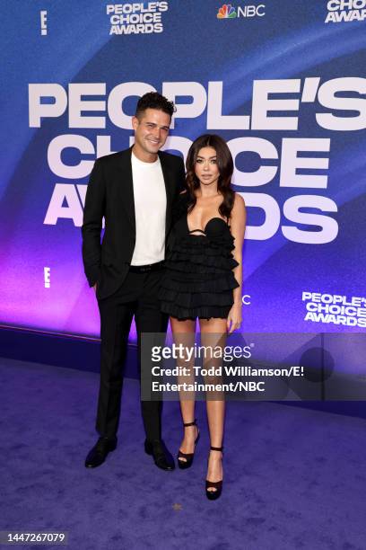 Pictured: Wells Adams and Sarah Hyland arrive to the 2022 People's Choice Awards held at the Barker Hangar on December 6, 2022 in Santa Monica,...