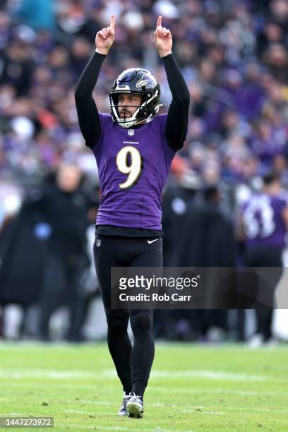 Place kicker Justin Tucker of the Baltimore Ravens celebrates an extra point against the Denver Broncos at M&T Bank Stadium on December 04, 2022 in...
