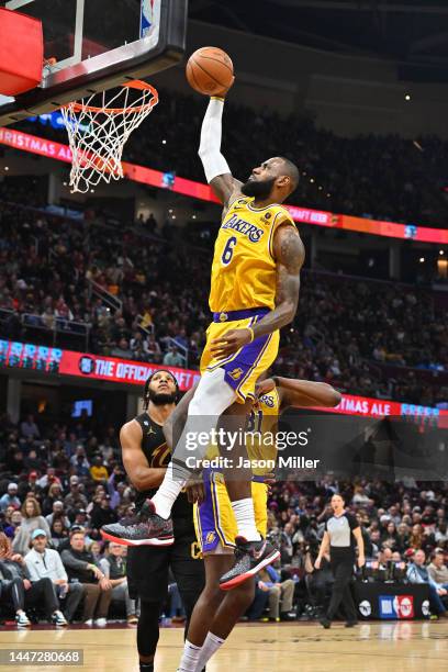 LeBron James of the Los Angeles Lakers dunks during the third quarter against the Cleveland Cavaliers at Rocket Mortgage Fieldhouse on December 06,...