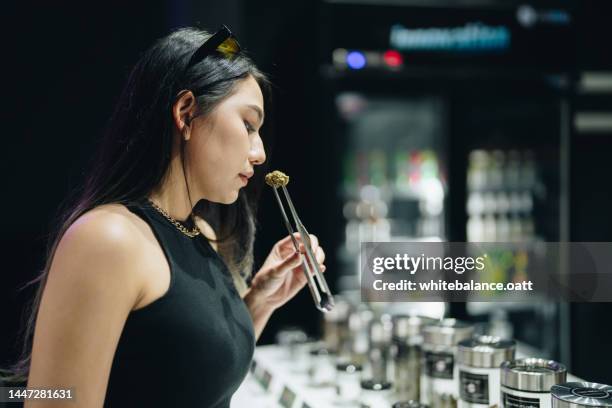 the process of choosing and buying cannabis. - cannabis dispensary stock pictures, royalty-free photos & images