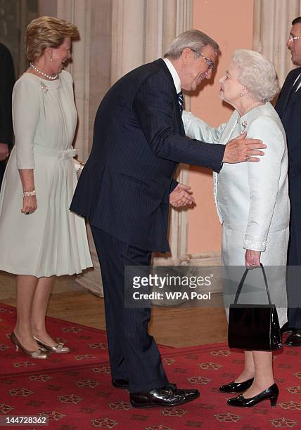 Queen Anne Marie Of Greece and King Constantine of Greece are greeted by Queen Elizabeth II as they arrive at a lunch for Sovereign Monarch's held in...