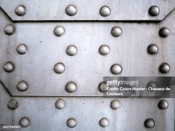 riveted metal plates, painted and patinated in gray in brussels - rivet stock pictures, royalty-free photos & images