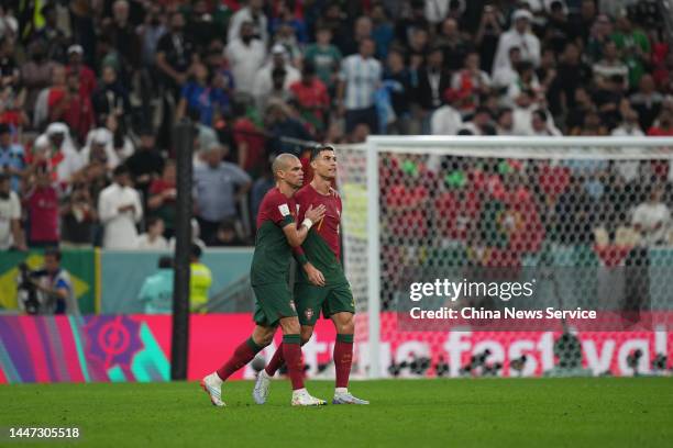 Cristiano Ronaldo and Pepe of Portugal in action during the FIFA World Cup Qatar 2022 Round of 16 match between Portugal and Switzerland at Lusail...