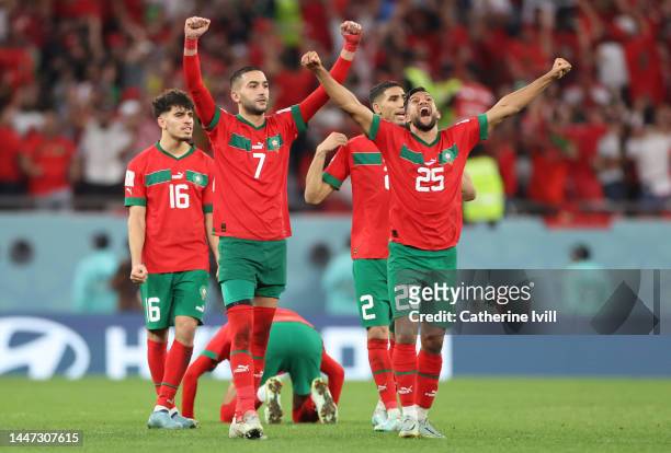 Hakim Ziyech and Yahya Attiat-Allah of Morocco celebrate during the penalty shootout in the FIFA World Cup Qatar 2022 Round of 16 match between...