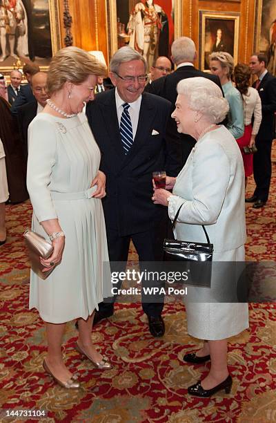 Queen Anne Marie Of Greece and King Constantine of Greece speak with Queen Elizabeth II as they arrive at a lunch in honour of Queen Elizabeth II's...