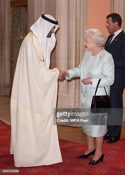 Crown Prince of Abu Dhabi Mohammed bin Zayed is greeted by Queen Elizabeth II at a lunch For Sovereign Monarchs in honour of Queen Elizabeth II's...