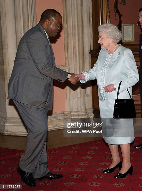 Queen Elizabeth II greets King Mswati III of Swaziland as he arrives at a lunch for Sovereign Monarch's held in honour of Queen Elizabeth II's...