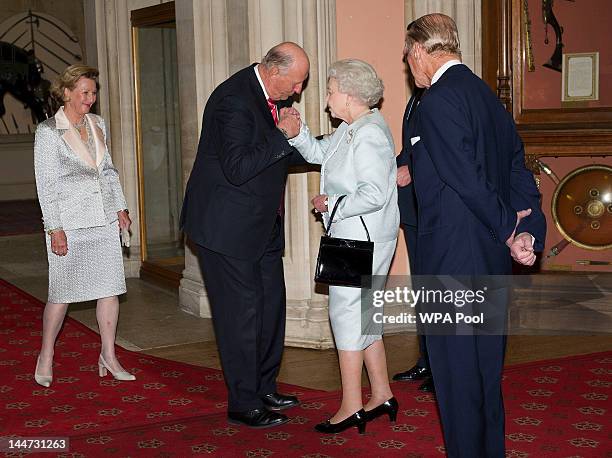 Queen Elizabeth II and Prince Philip, Duke of Edinburgh greet King Harald V of Norway and Queen Sonja of Norway as they arrive at a lunch for...