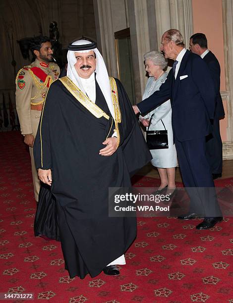 Queen Elizabeth II and Prince Philip, Duke of Edinburgh greet The King of Bahrain Hamad bin Isa Al Khalifa he arrives at a lunch for Sovereign...