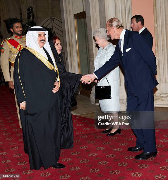 Queen Elizabeth II and Prince Philip, Duke of Edinburgh greet The King of Bahrain Hamad bin Isa Al Khalifa and Princess Sabeeka as they arrive at a...