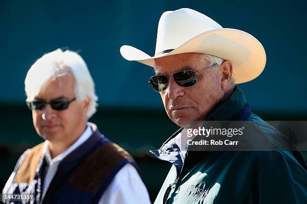 Bob Baffert, trainer of Bodemeister and D. Wayne Lukas, trainer of Optimizer, talk in the barn area after training their horses for the 137th...