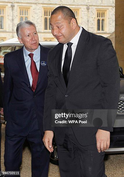 King Tupou VI of Tonga is greeted by The Master of the Household Air Marshal Sir David Walker as he arrives at a lunch For Sovereign Monarchs in...