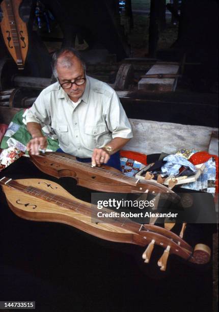 Dulcimer maker plays his handmade instrument for visitors at the annual Tennessee Fall Homecoming at the Museum of Appalachia in Norris, Tennessee....