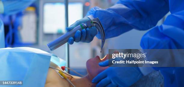 close-up of intubating patient , preparations for operation. - intubation fotografías e imágenes de stock