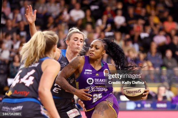 Tiffany Mitchell of the Boomers handles the ball against Lauren Nicholson of the Fire during the round five WNBL match between Melbourne Boomers and...