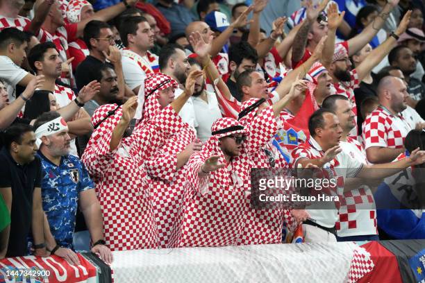 Fans of Croatia cheer during the FIFA World Cup Qatar 2022 Round of 16 match between Japan and Croatia at Al Janoub Stadium on December 05, 2022 in...