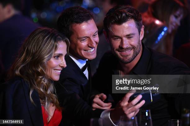Rove McManus takes a selfie with Chris Hemsworth and Elsa Pataky during the 2022 AACTA Awards Presented By Foxtel Group at the Hordern on December...