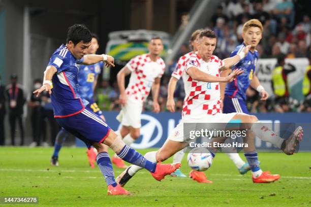 Wataru Endo of Japan attempts a shot during the FIFA World Cup Qatar 2022 Round of 16 match between Japan and Croatia at Al Janoub Stadium on...