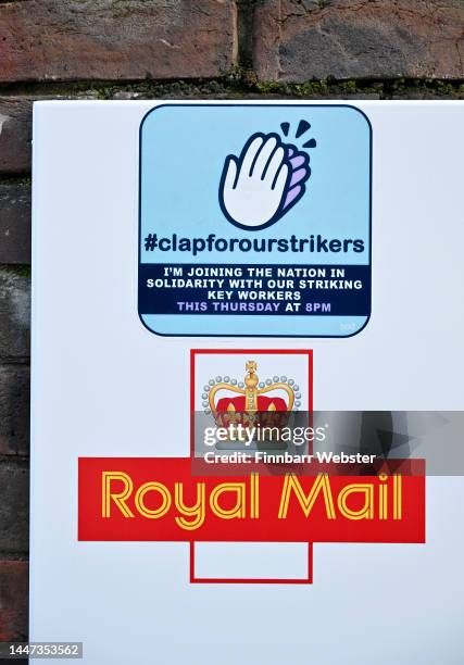 Sticker on the Royal Mail sorting office building by political protest artist ‘Bod’ calling for the nation to support the key worker strikers with...