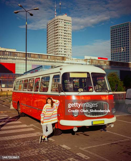 woman near vintage red van in  warsaw - skyscraper film stock pictures, royalty-free photos & images