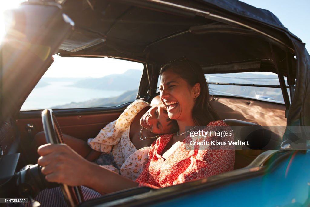 Young woman in car with female friend