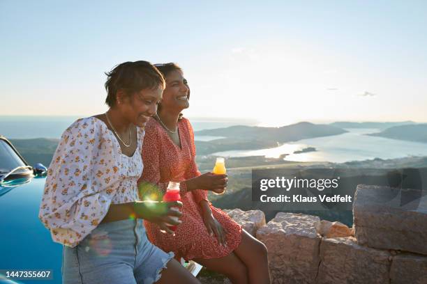 friends having juice together on road trip - blue sky friends stock pictures, royalty-free photos & images