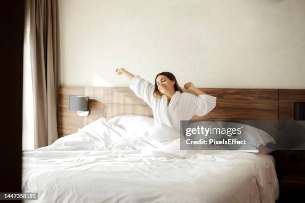 stretching out before getting up - robe stock pictures, royalty-free photos & images