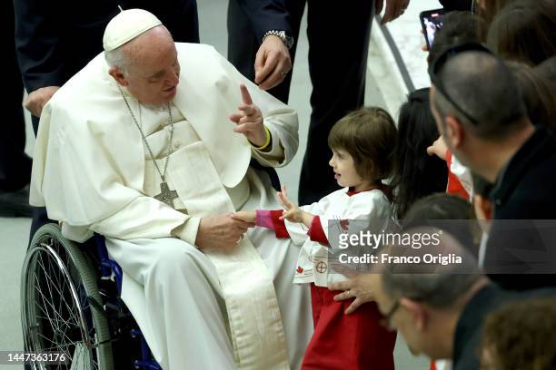 Pope Francis greets children as he leaves the Paul VI Hall after the weekly general audience on December 07, 2022 in Vatican City, Vatican. At the...