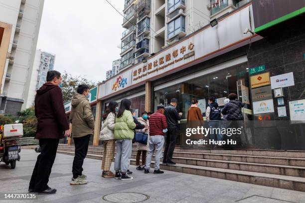 People line up outside of community center for COVID-19 vaccination on December 07, 2022 in Shanghai, China.