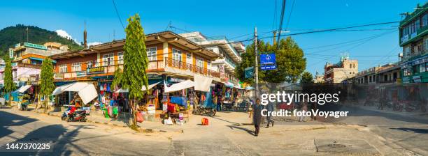 pokhara people on busy streets of nepal's second city panorama - pokhara stock pictures, royalty-free photos & images