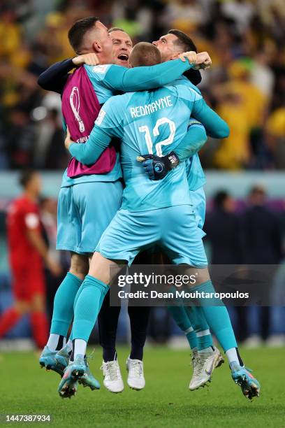 Goalkeeper, Mathew Ryan of Australia celebrates their 1-0 victory with Danny Vukovic and Andrew Redmayne after the FIFA World Cup Qatar 2022 Group D...