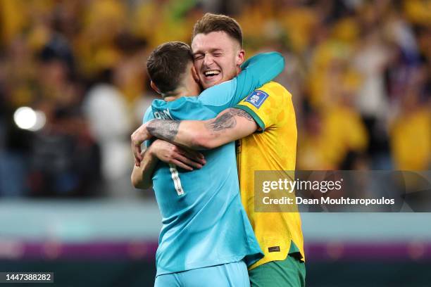 Goalkeeper, Mathew Ryan and Harry Souttar of Australia celebrate their 1-0 victory after the FIFA World Cup Qatar 2022 Group D match between...