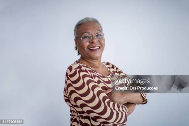 senior woman portrait in photo studio - african american people stock pictures, royalty-free photos & images
