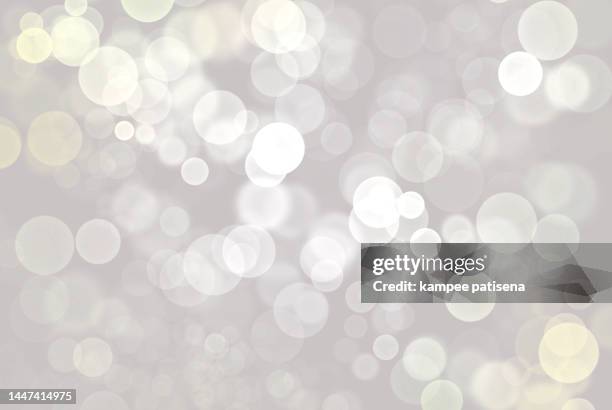 defocused image of illuminated lights white background - lens flare transparent stock pictures, royalty-free photos & images