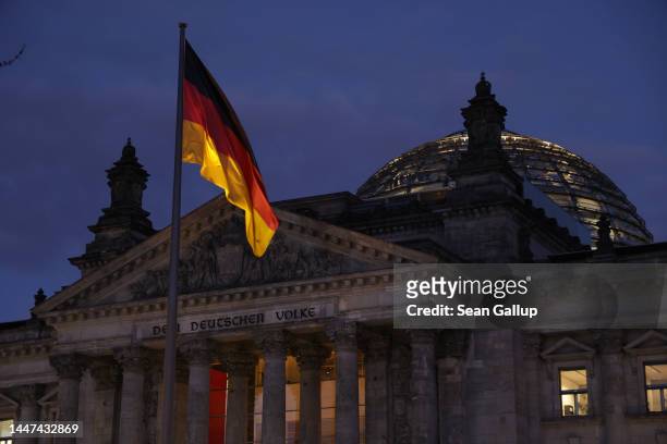 The Reichstag, seat of the Bundestag, Germany's parliament, stands at dusk on the day police conducted nationwide raids against a suspected...