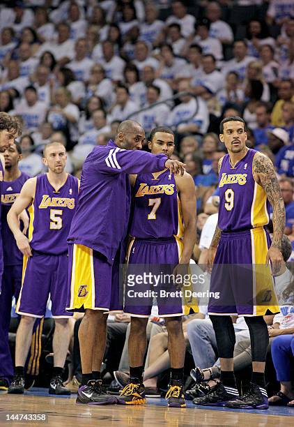Kobe Bryant and Ramon Sessions of the Los Angeles Lakers talk during a timeout against the Oklahoma City Thunder in Game Two of the Western...