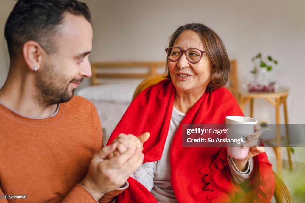 Volunteer Young Man Visiting Senior Lady for Emotional Support