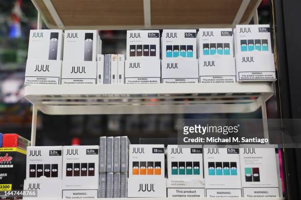 Juul packages are seen on a shelf at Empire Smoke Shop on December 07, 2022 in the Flatbush neighborhood of Brooklyn borough in New York City. Juul...