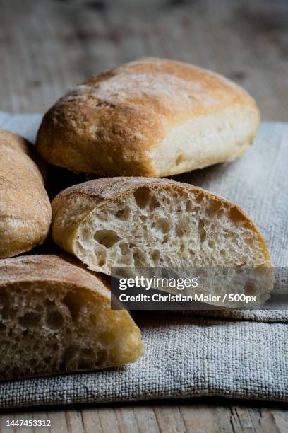 high angle view of bread on table,memmingen,germany - ciabatta stock-fotos und bilder