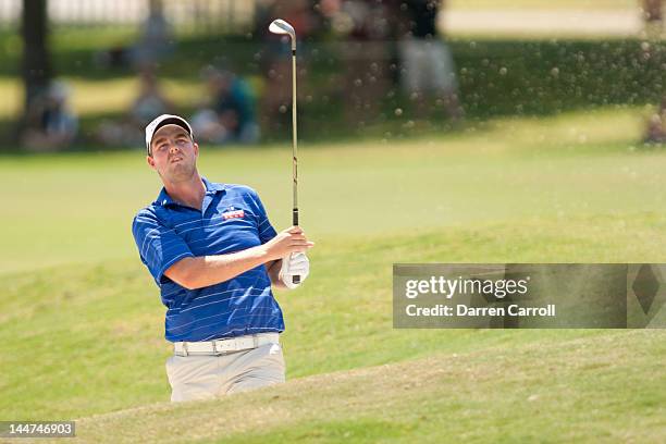 Marc Leishman of Australia plays a bunker shot at the first hole during the second round of the HP Byron Nelson Championship at TPC Four Seasons...